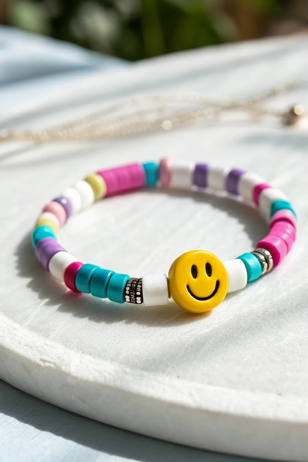 Preppy smiley centerpiece clay heishi bracelet with bold color blocks, minimal Scandinavian styling.
