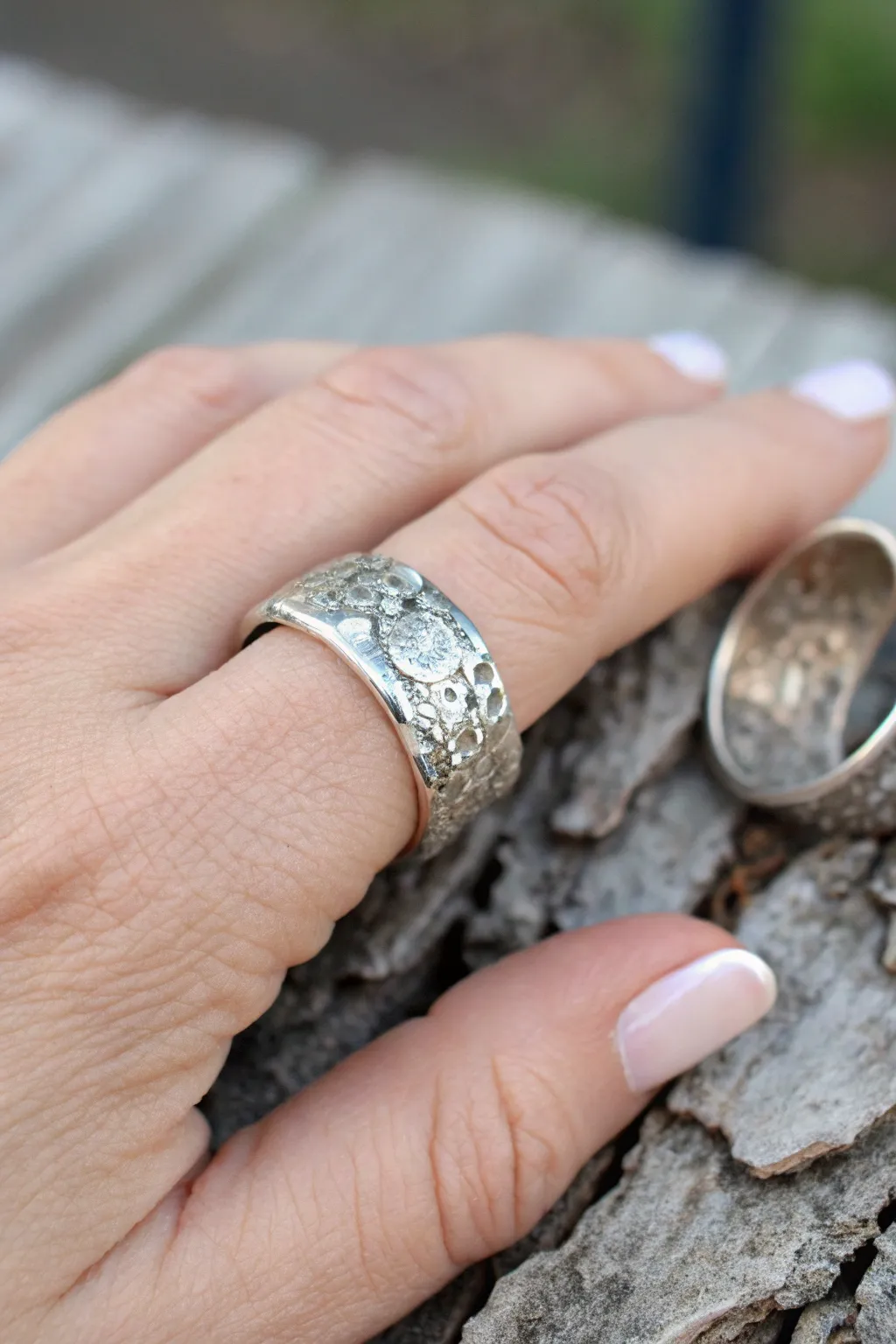 Textured wide-band silver clay ring with oxidized depth, minimalist yet bold for everyday wear.