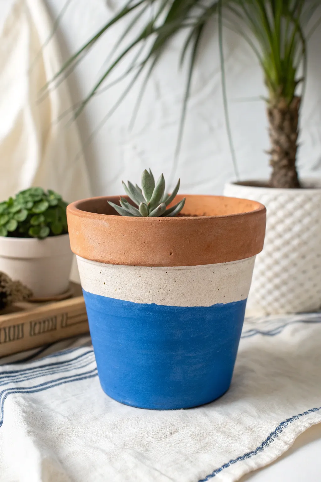 Dipped bottom color pop: crisp cobalt band on natural clay for an easy, modern DIY look.