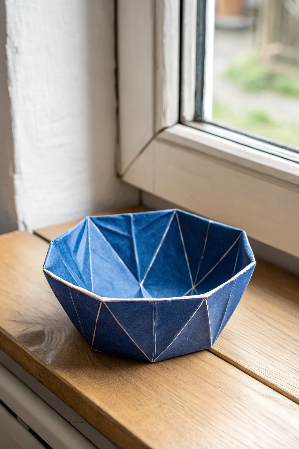 Crisp origami-style slab bowl in matte cobalt, a minimalist statement with handmade character.