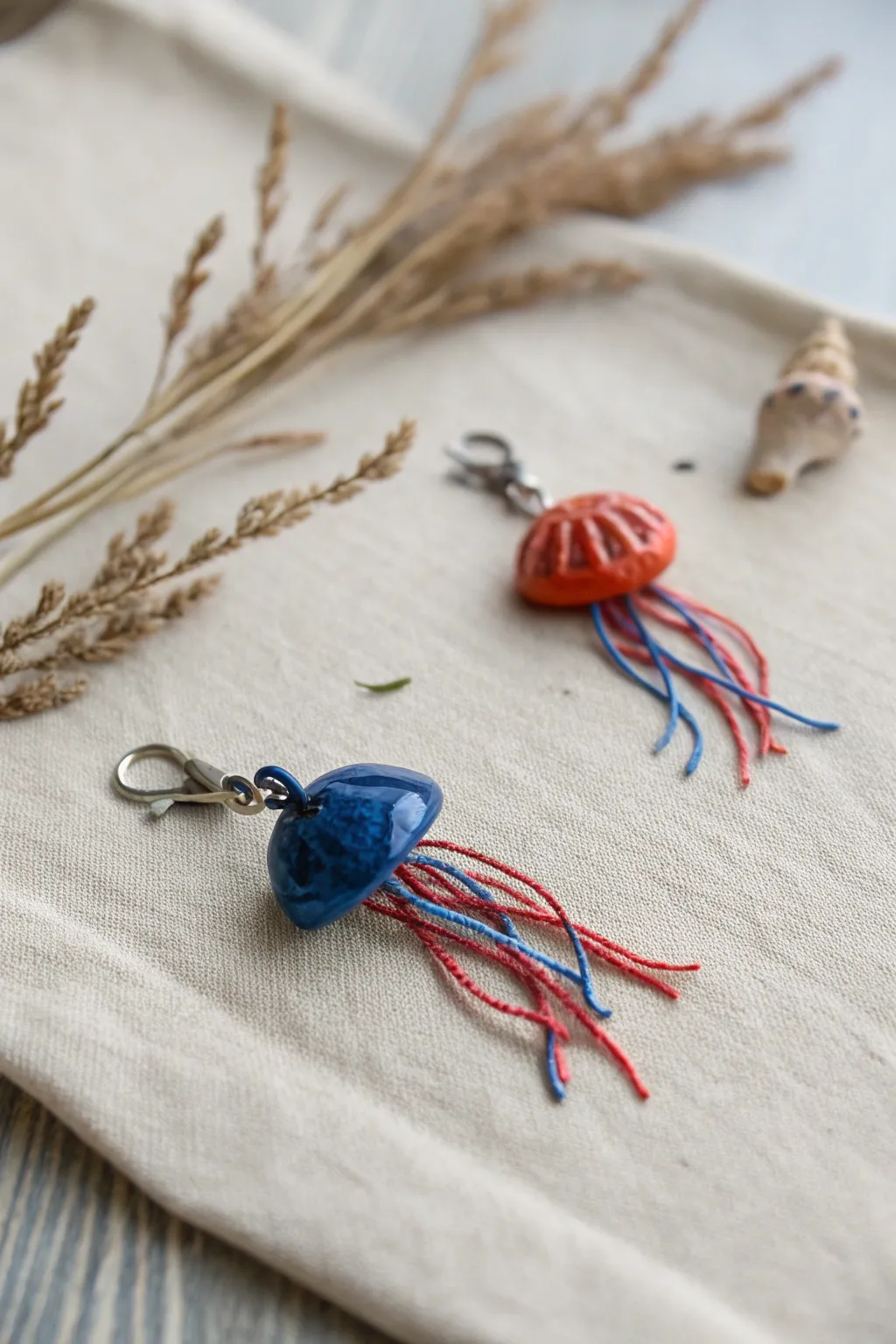 Bold mini clay jellyfish charm with simple tentacles, a cute finished piece for easy small art ideas.