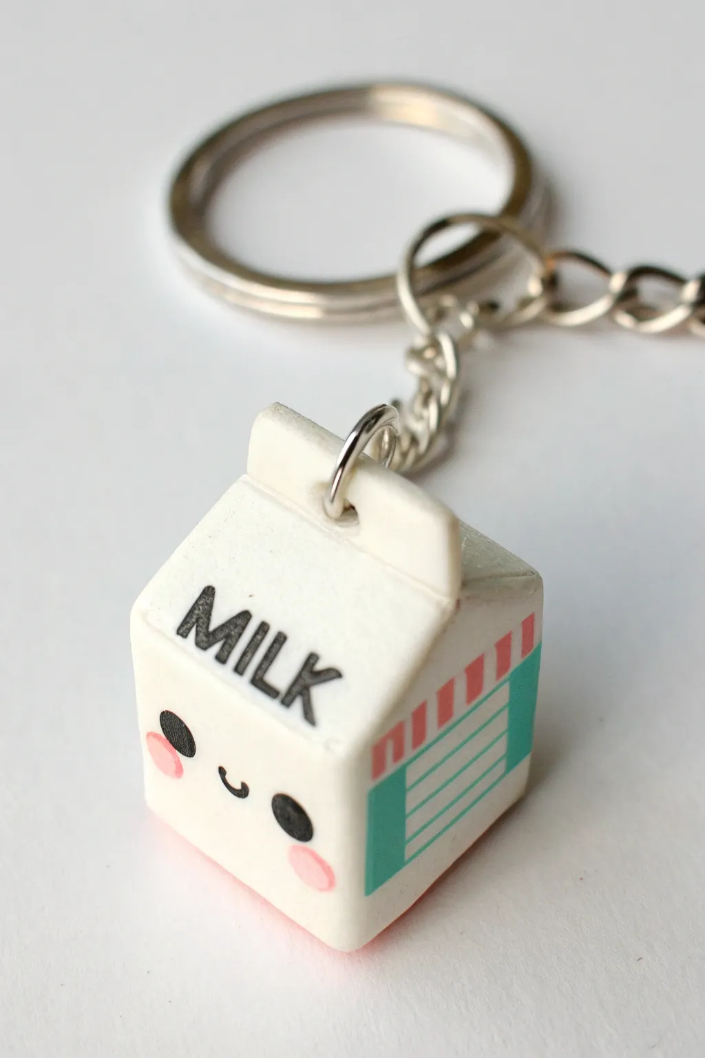 Sweet tiny milk carton charm in bold pastel tones, minimalist and handmade, ready for your keys