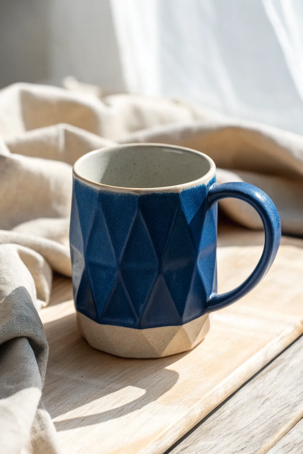 Faceted satin-glazed mug with crisp planes and bold color for a modern minimalist look