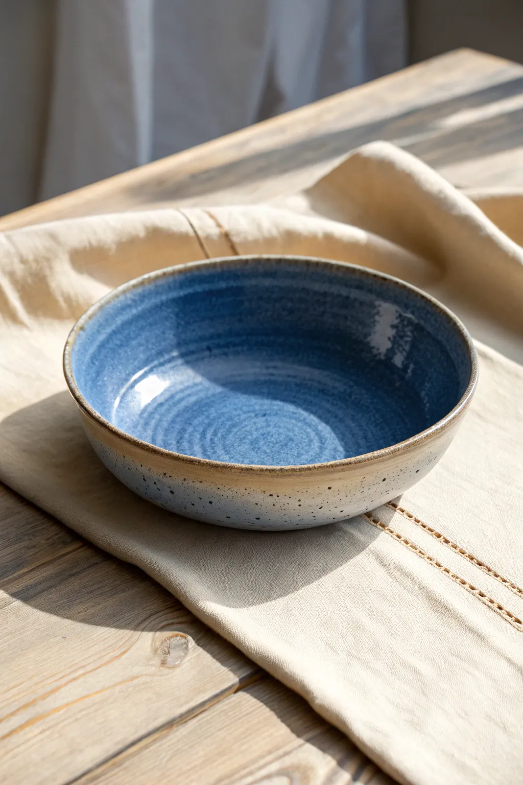 Low, wide wheel-thrown pasta bowl with a soft rim, bold glaze, and calm Nordic styling