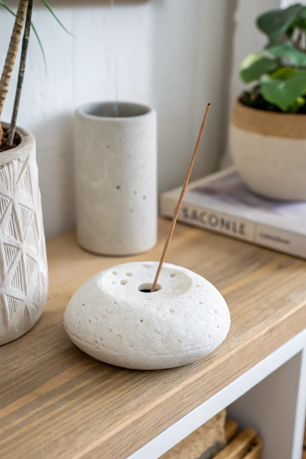 Minimal pebble-style white clay incense holder with a clean boho vibe and calming contrast.