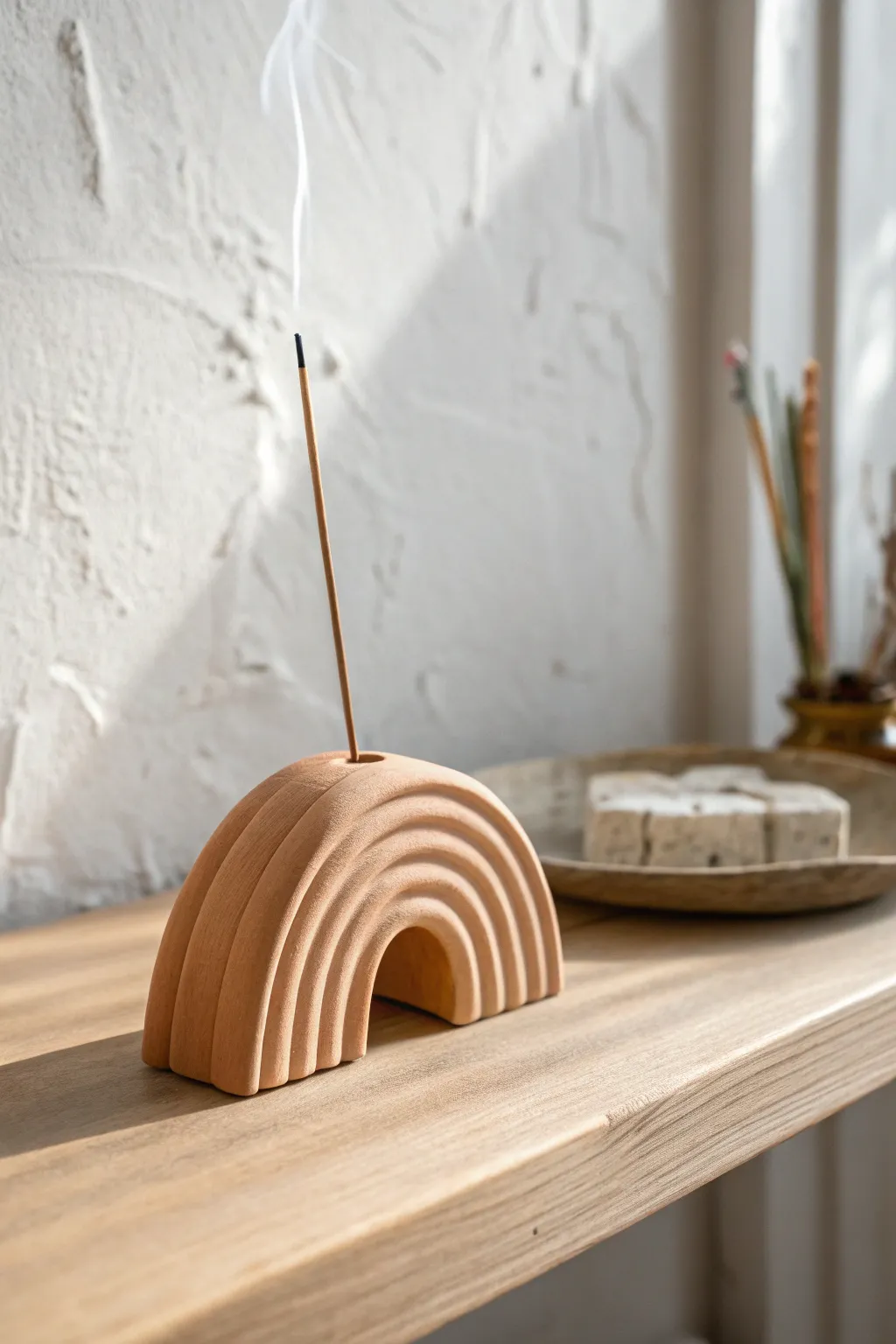 Minimal arch incense holder in warm clay tones for a calm, modern shelf moment