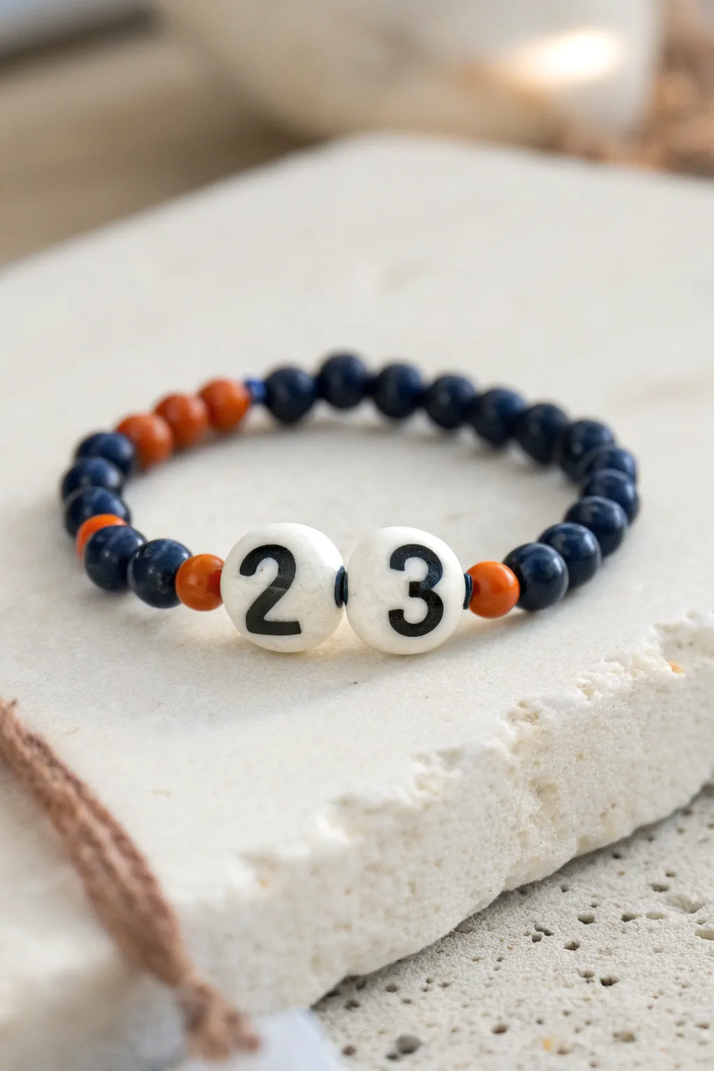 DIY-ready jersey number bead bracelet in team colors, minimalist and feminine with crisp contrast