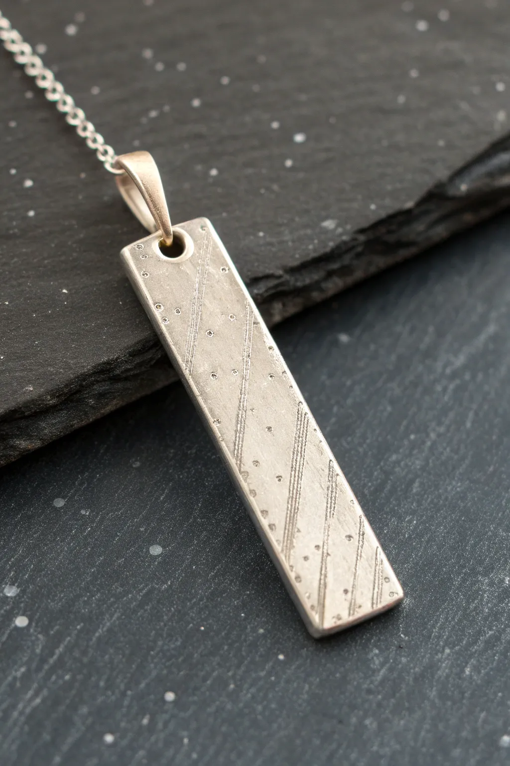 Minimalist silver clay bar pendant with soft texture, crisp contrast, and handmade elegance