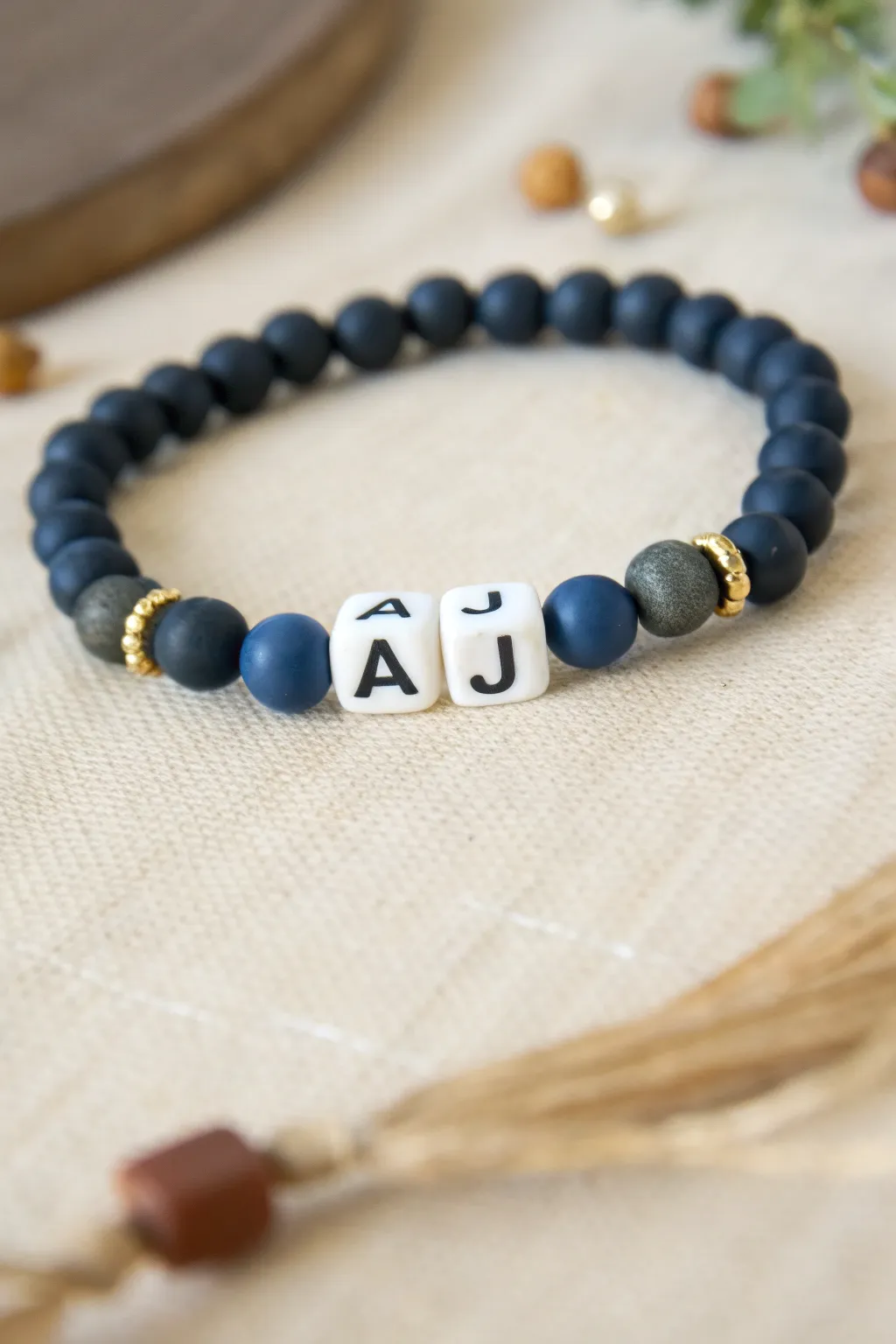 Dark clay bead bracelet with bold initial beads, Scandinavian minimal style with a soft boho touch