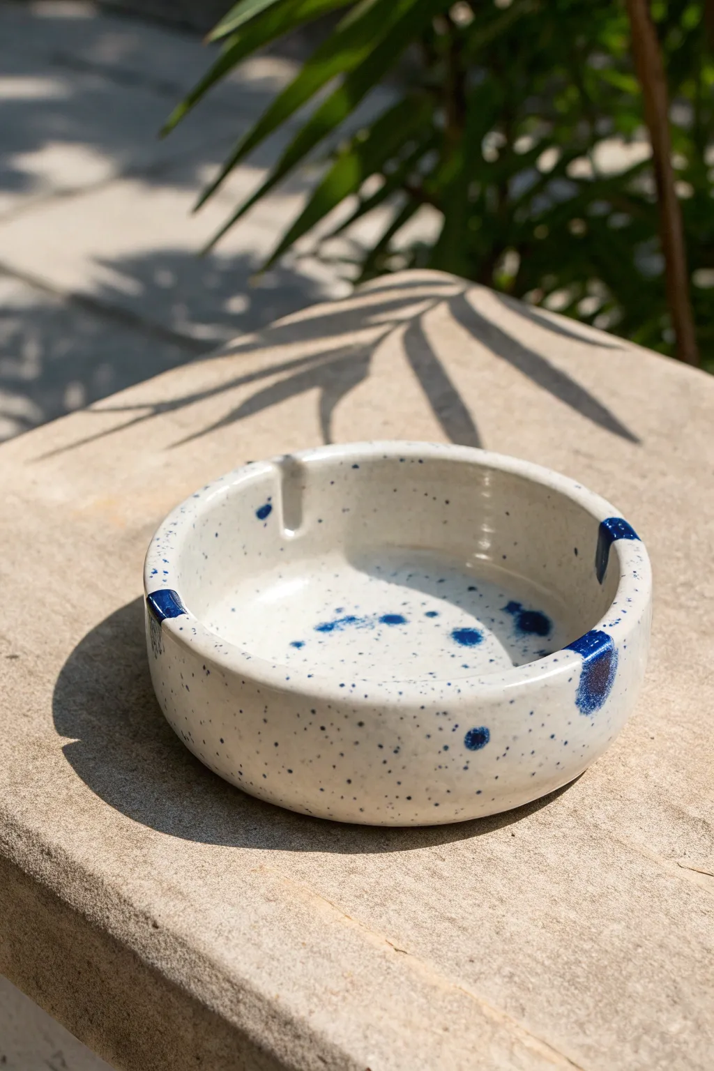 Minimalist ashtray with a bold snuffer island and bright glaze contrast for a modern look