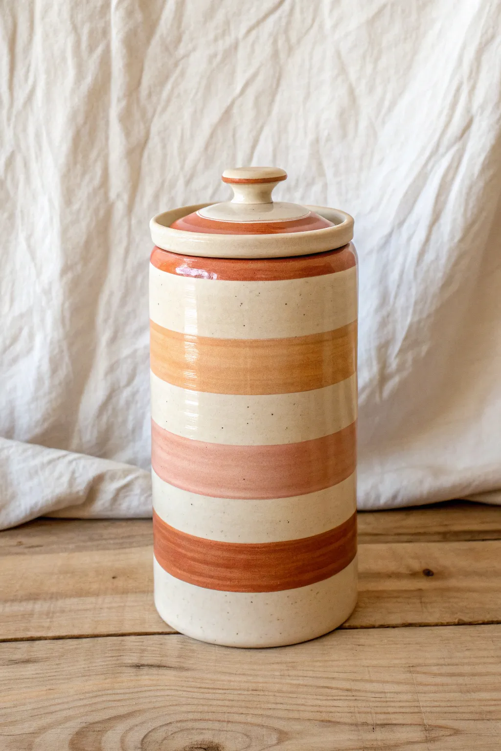 Striped ceramic cookie jar with a cheerful color pop, clean lines, and handmade charm.