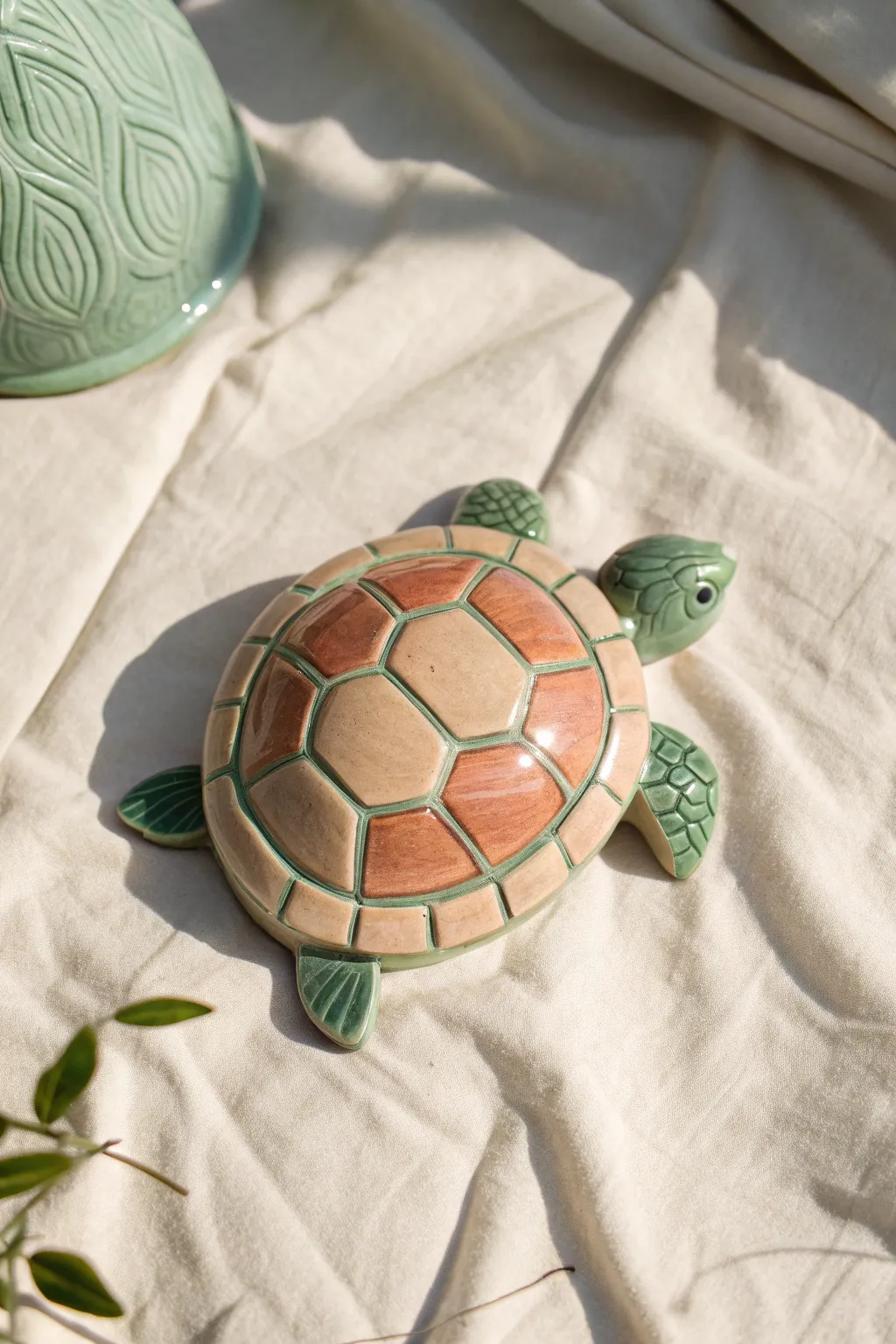 Bold black-outlined shell segments with soft matte colors for an easy, modern ceramic turtle look