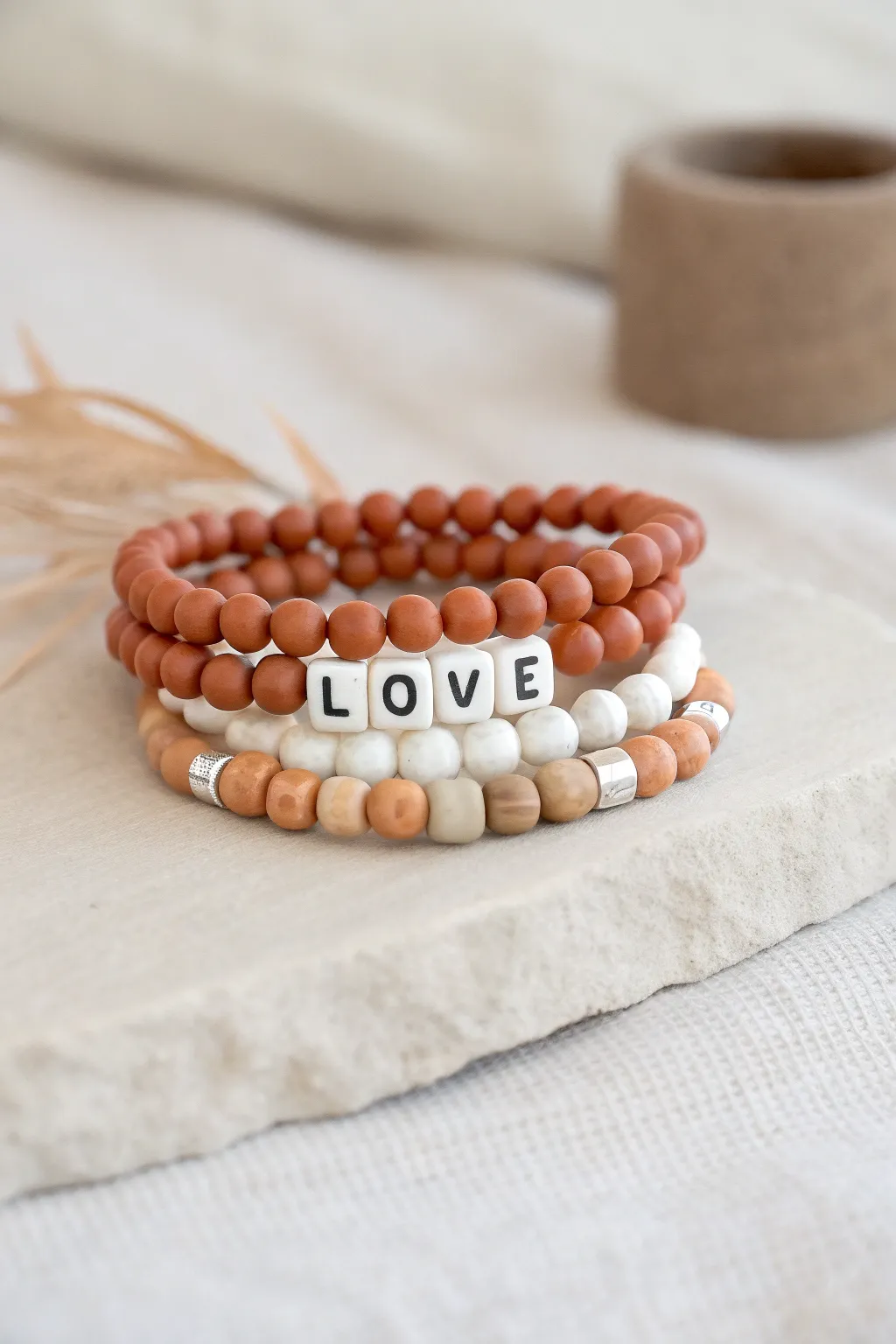 Soft clay bead bracelet set with a centered LOVE word bracelet, Scandinavian boho vibe.