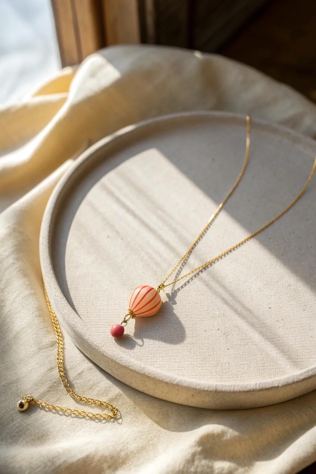 Sweet balloon charm necklace in cheerful clay colors, a handmade birthday gift with minimalist style