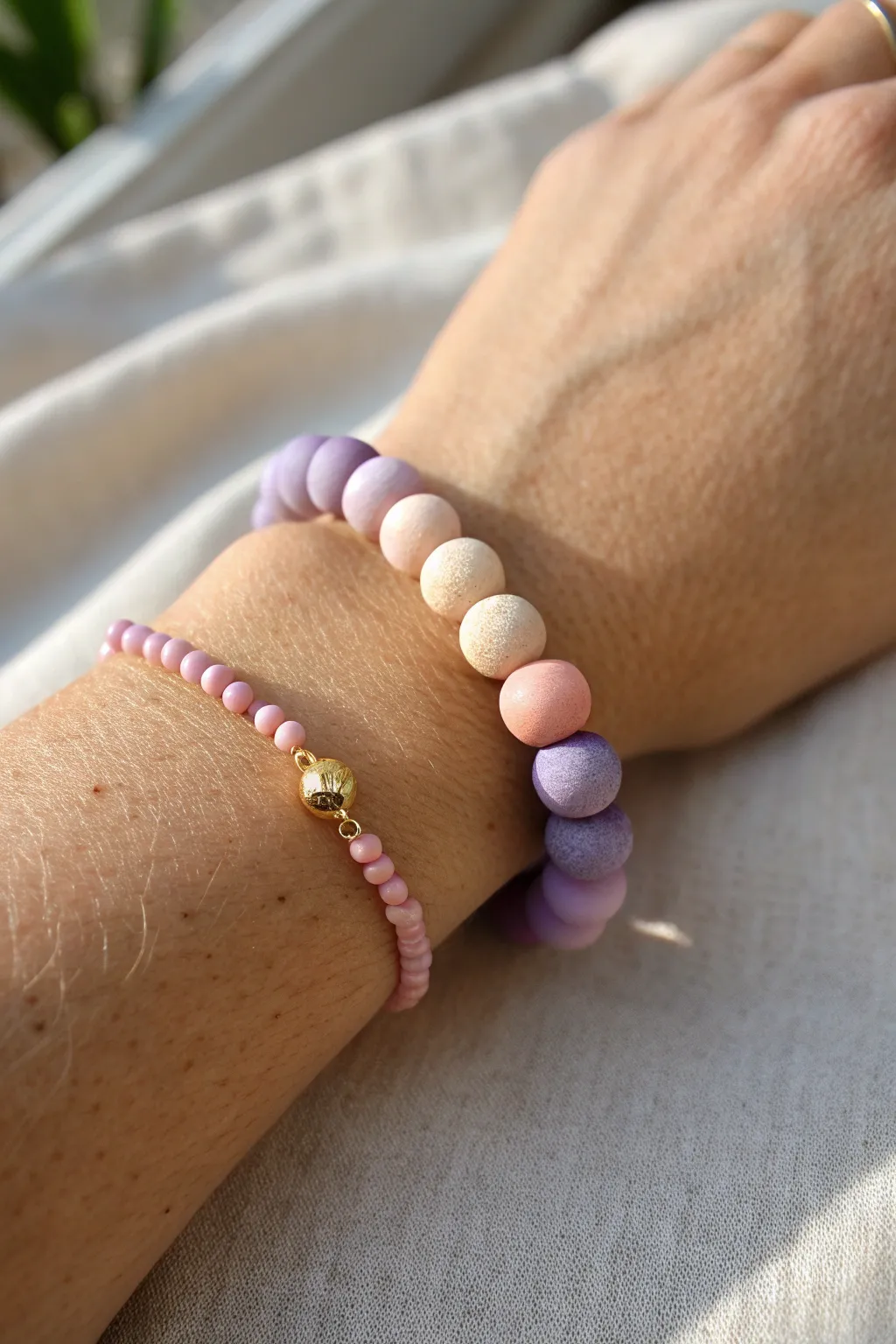 Soft ombre clay bead bracelet in lavender, blush, and peach for a dreamy minimalist look.
