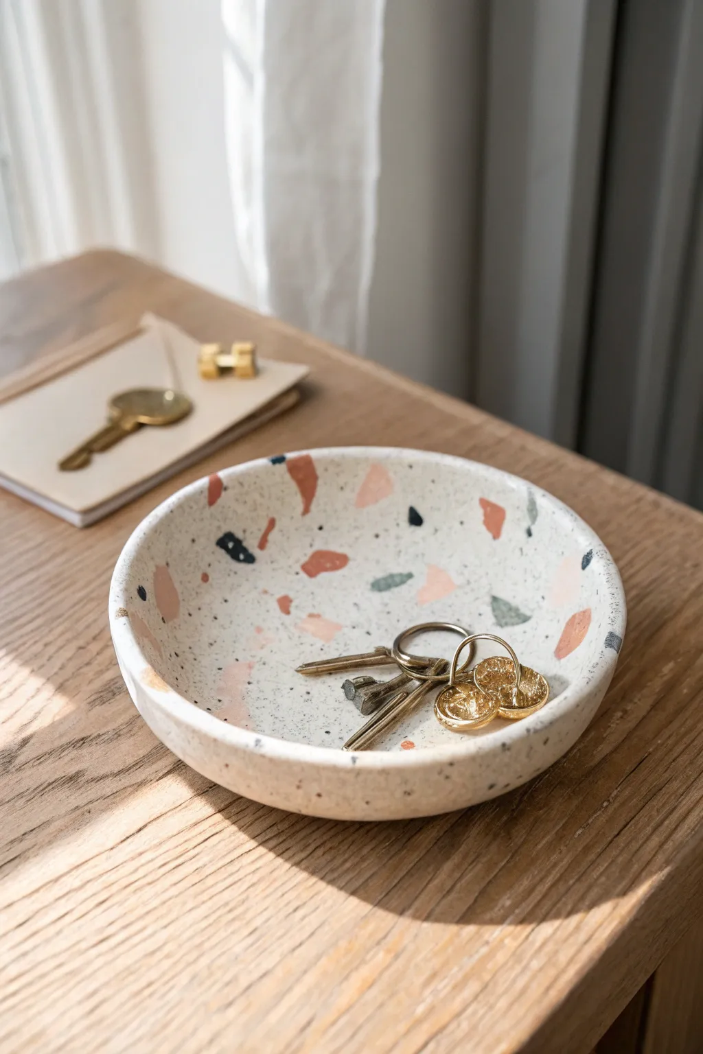 Terrazzo confetti clay dish to brighten your desk, a cheerful catchall for tiny essentials.
