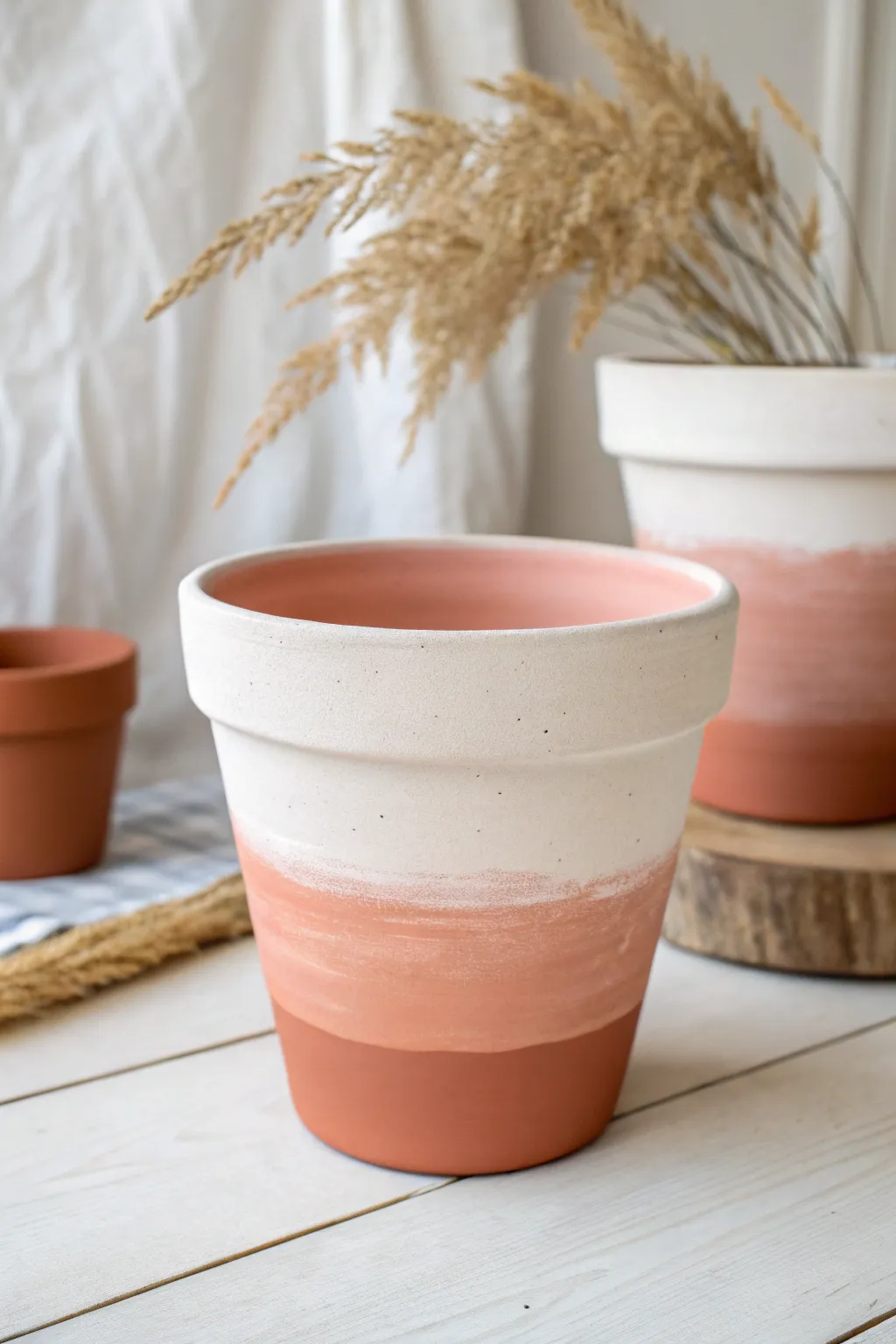 DIY ombre clay pot in blush tones, minimalist Scandinavian look with a soft boho touch.