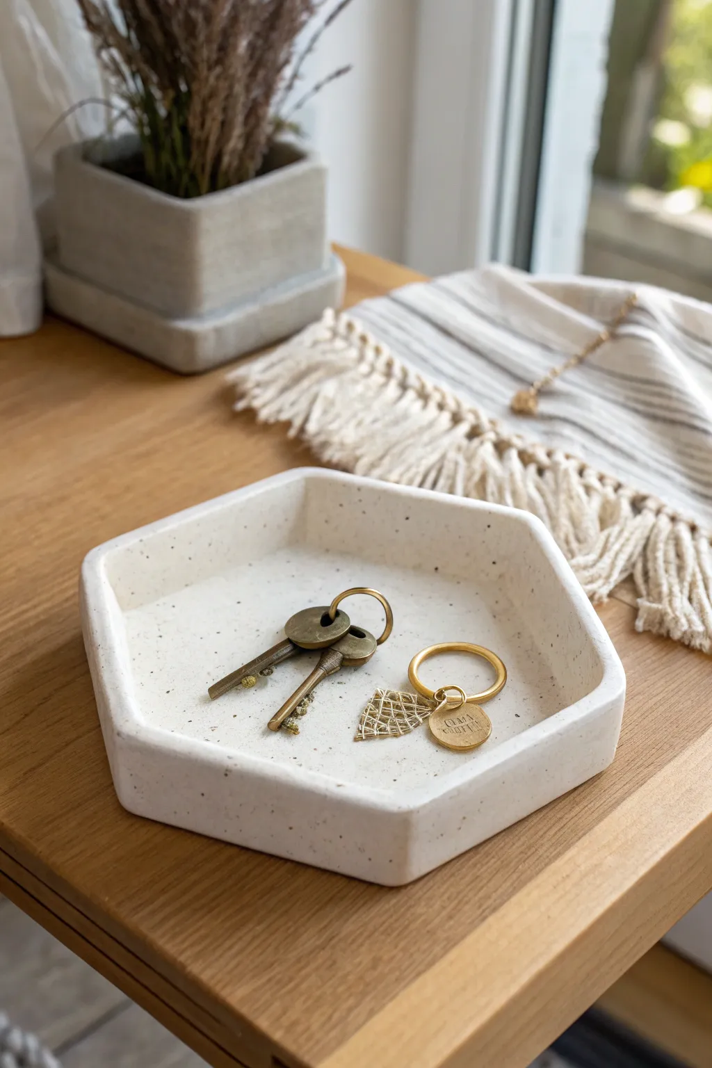 Matte hexagon catchall tray with keys and rings, a calm minimal clay holder for the entryway