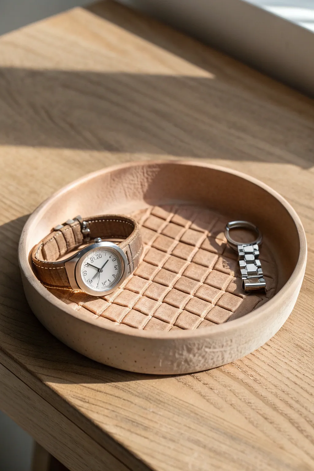 Minimal stamped-texture valet dish to keep a watch and ring tidy, crafted in warm matte clay.