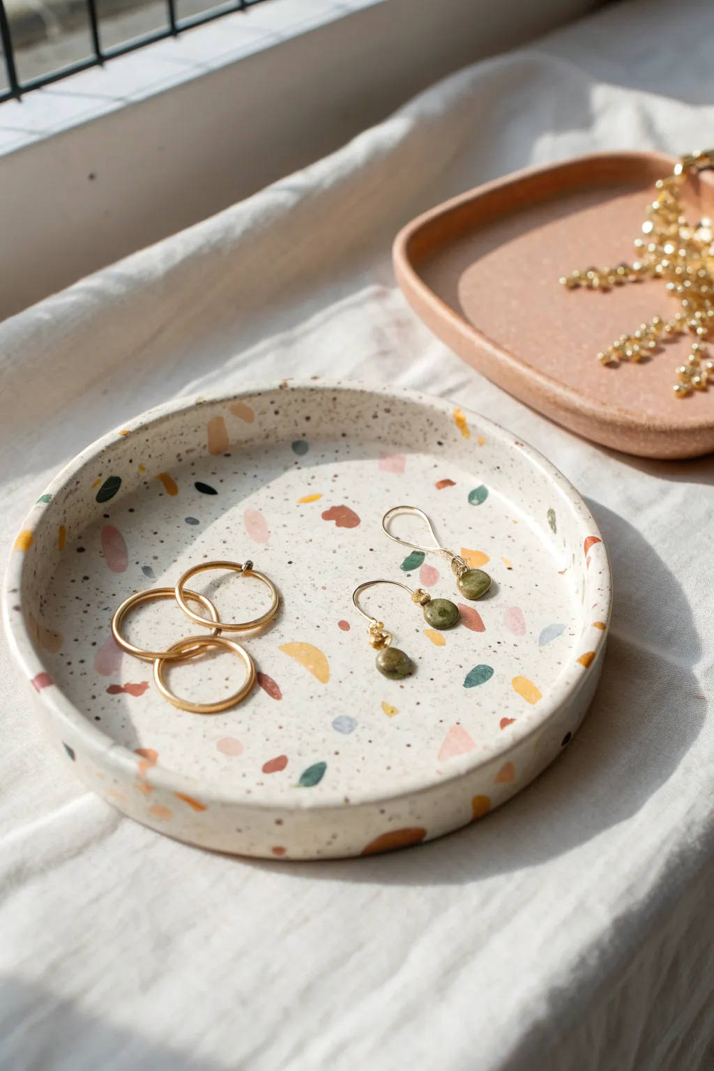 Terrazzo speckle clay tray adds a modern, handmade spot for earrings and pins on your vanity