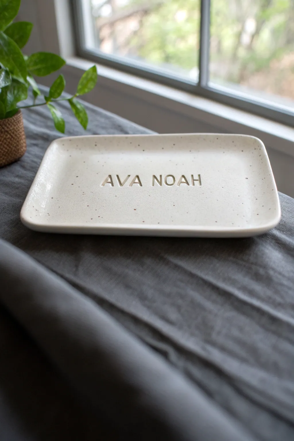Minimal clay name plate with raised ampersand, perfect for a couple entryway shelf.