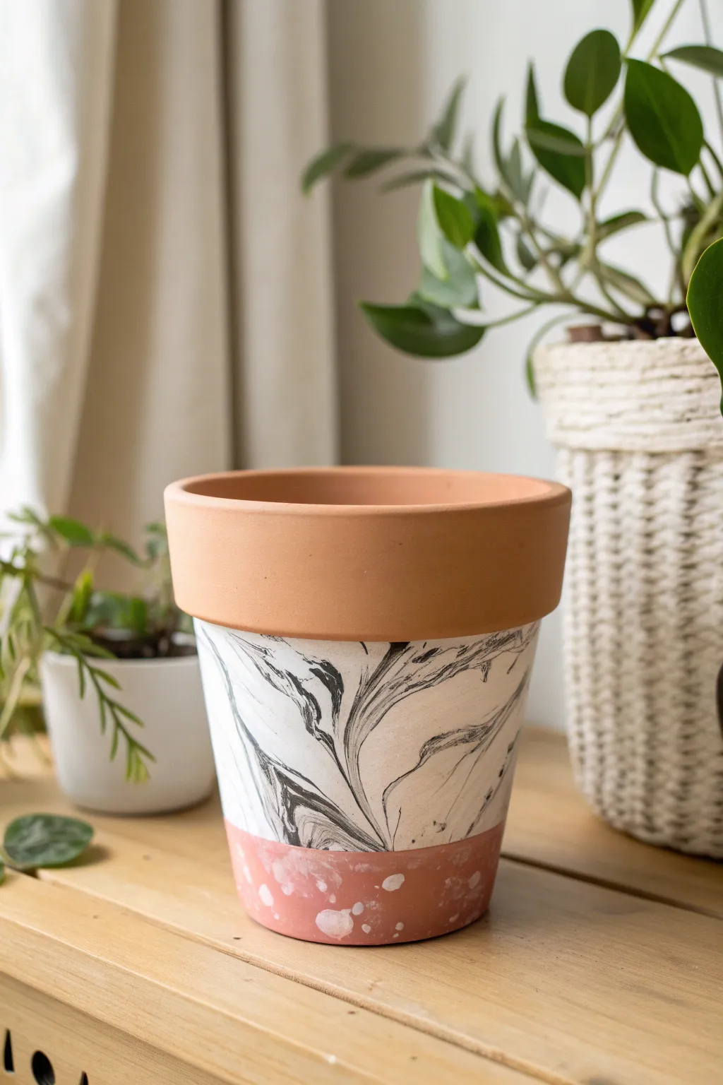 Minimal terracotta pot with bold marbled dip band, Scandinavian styling and warm boho calm.