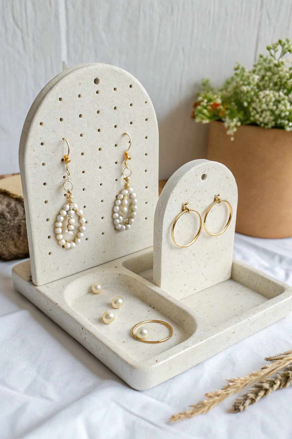 Minimal clay earring organizer set in soft neutrals, showcasing tidy storage with boho charm.