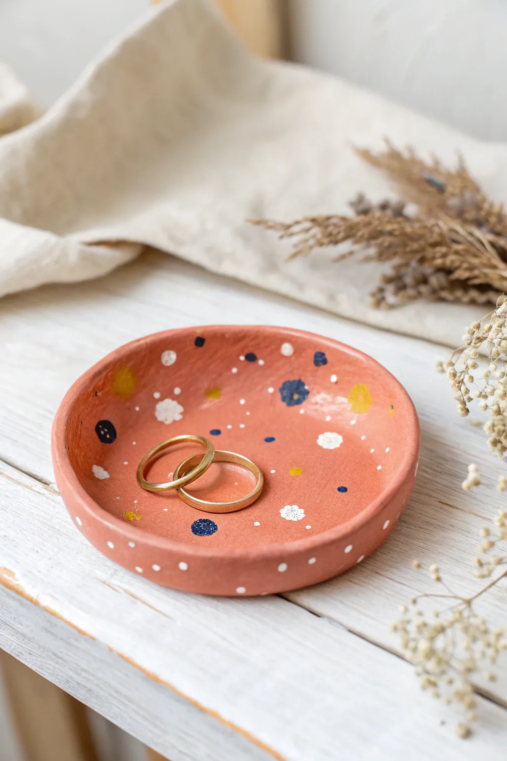 Bright confetti trinket dish adds playful color while keeping rings tidy on your vanity
