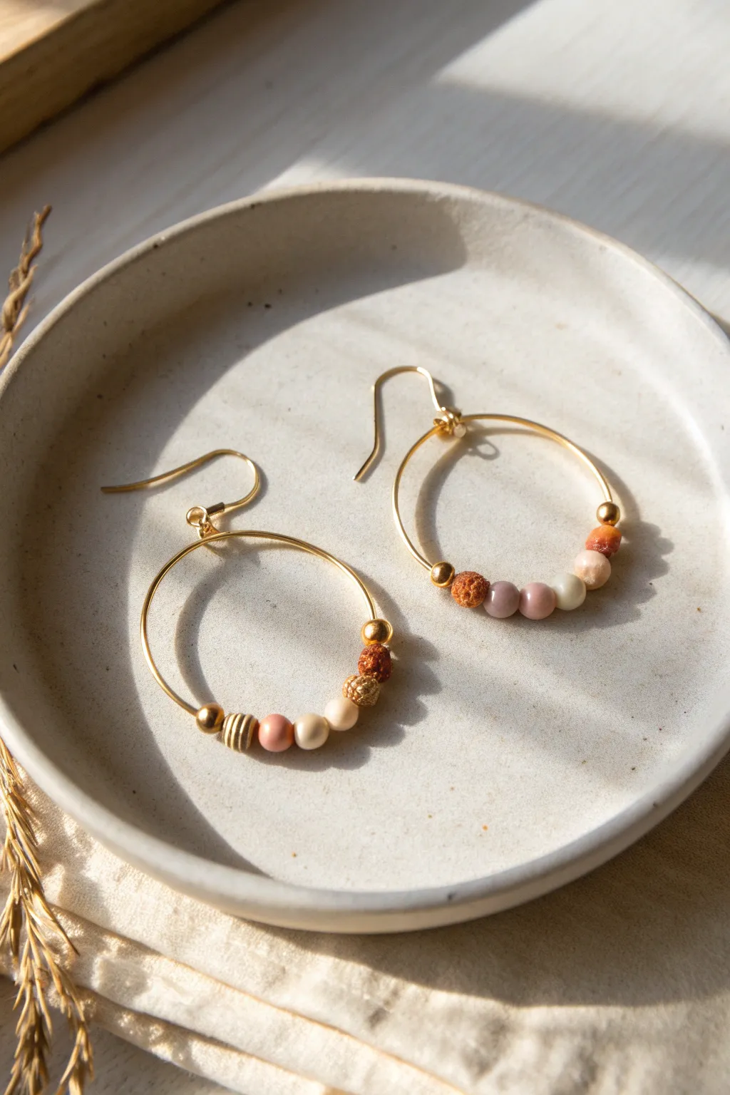 Half-hoop clay bead stacks in soft neutrals, airy negative space and effortless minimalist charm