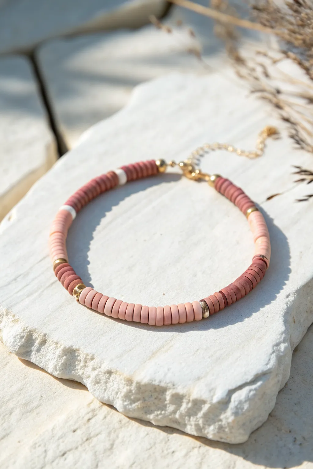 Smooth ombre heishi bracelet fading from deep rose to blush, minimalist and boho chic.