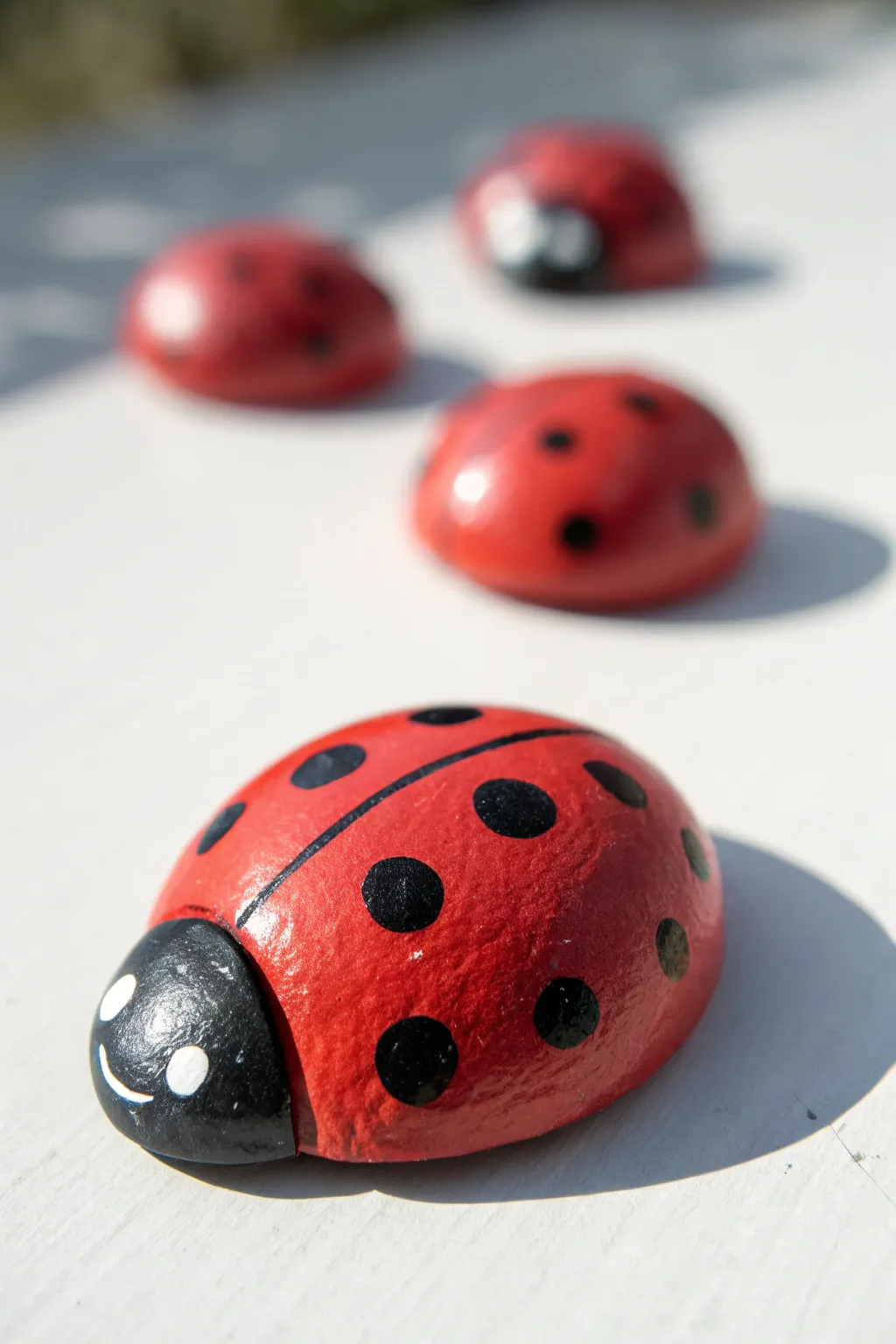 Sweet ladybug clay stones to paint with kids, simple, cheerful, and oh so display-worthy