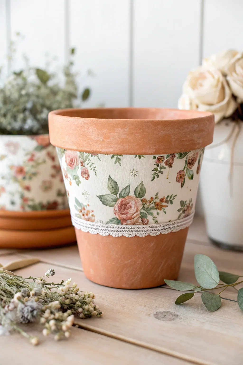 Soft floral decoupage clay pot with sealed matte finish, styled in airy Scandinavian boho decor