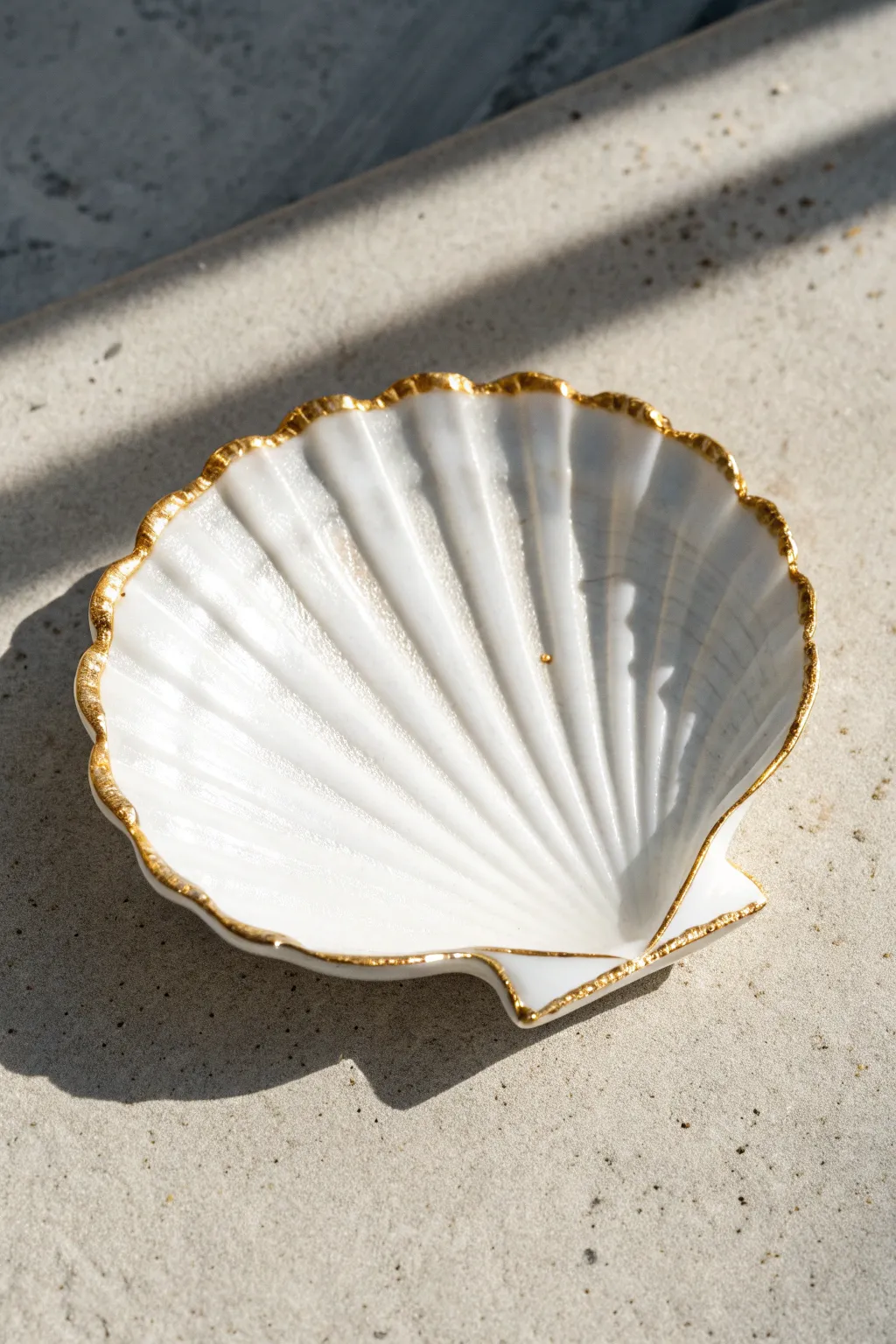 Elevate simple seashells with a touch of metallic gold for a luxe minimalist look.