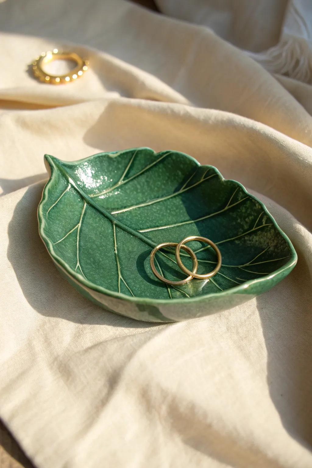 Deep green leaf trinket dish with delicate veins, a simple handmade spot for rings and studs