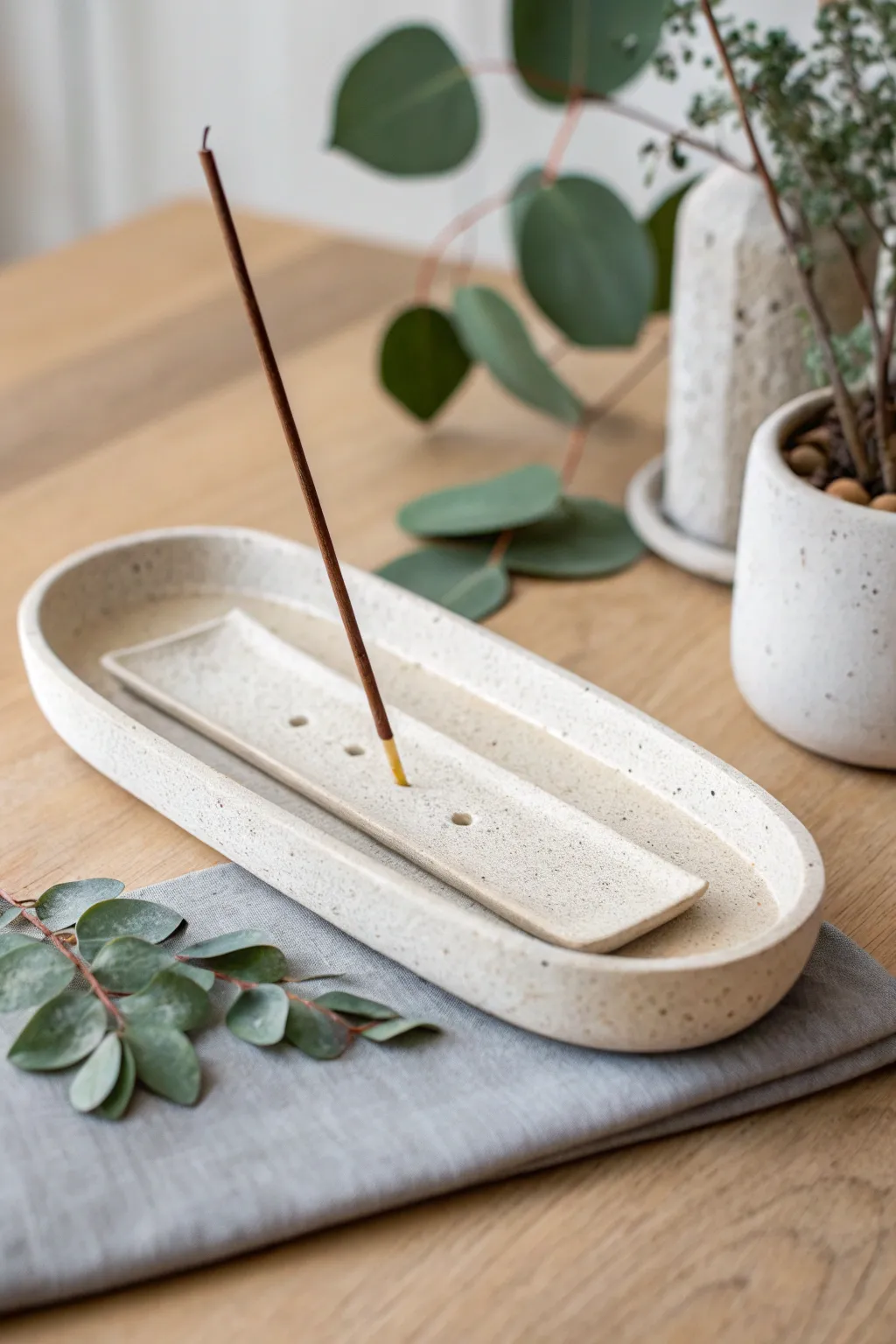 Minimal speckled oven-bake clay incense holder with calm spa styling and warm Scandinavian tones