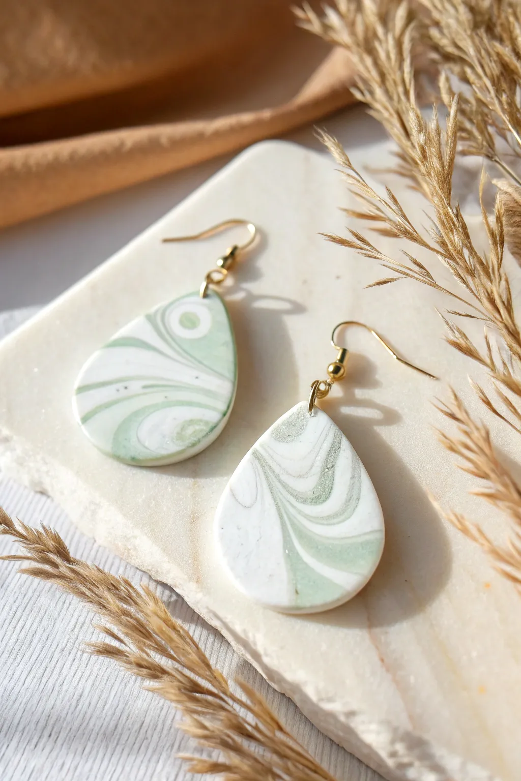 Soft marble swirl drop earring in muted tones, minimalist boho style polymer clay inspiration