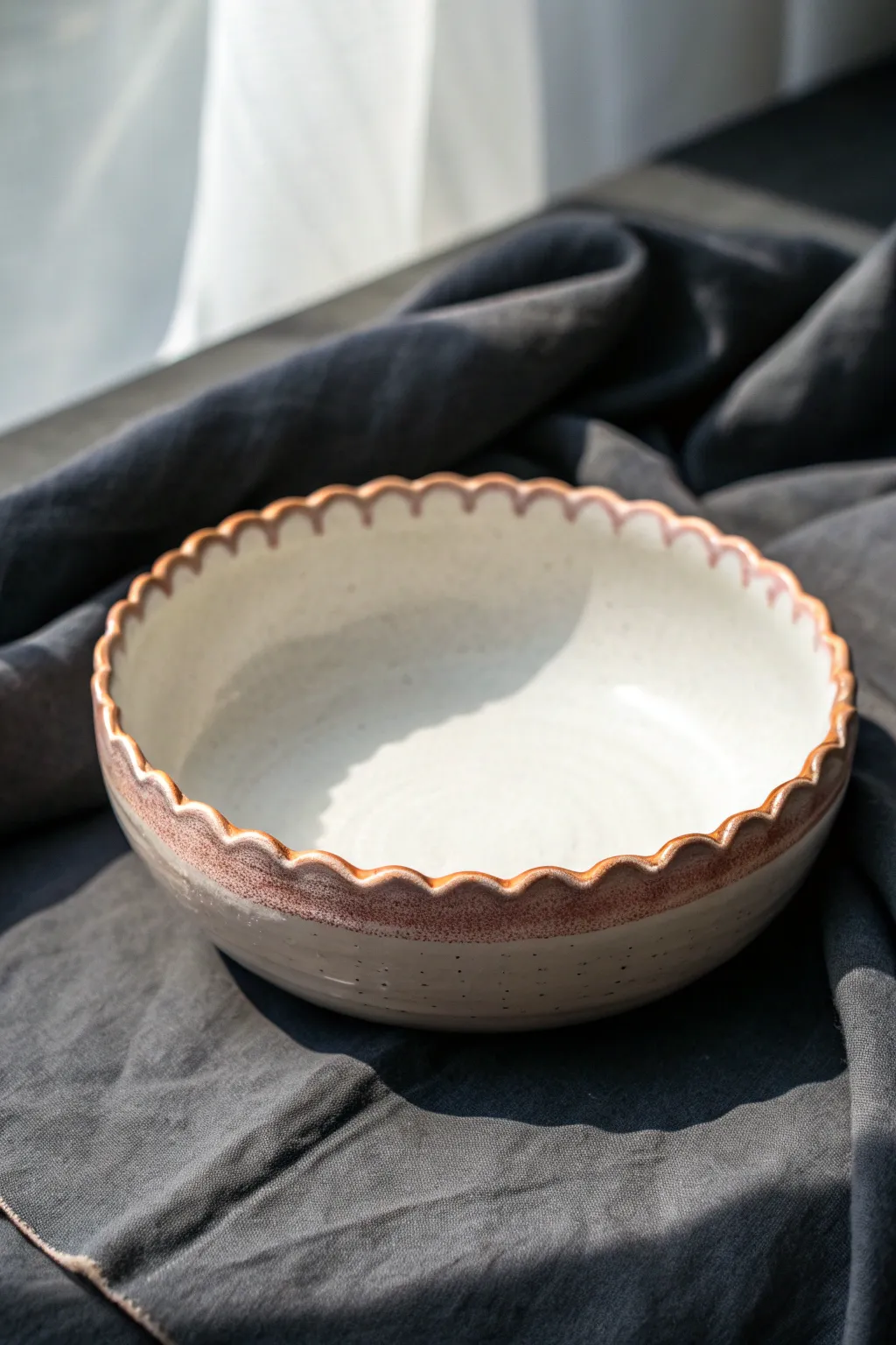 Sweet scalloped rim border keeps this shallow bowl minimal, tidy, and perfect for serving.