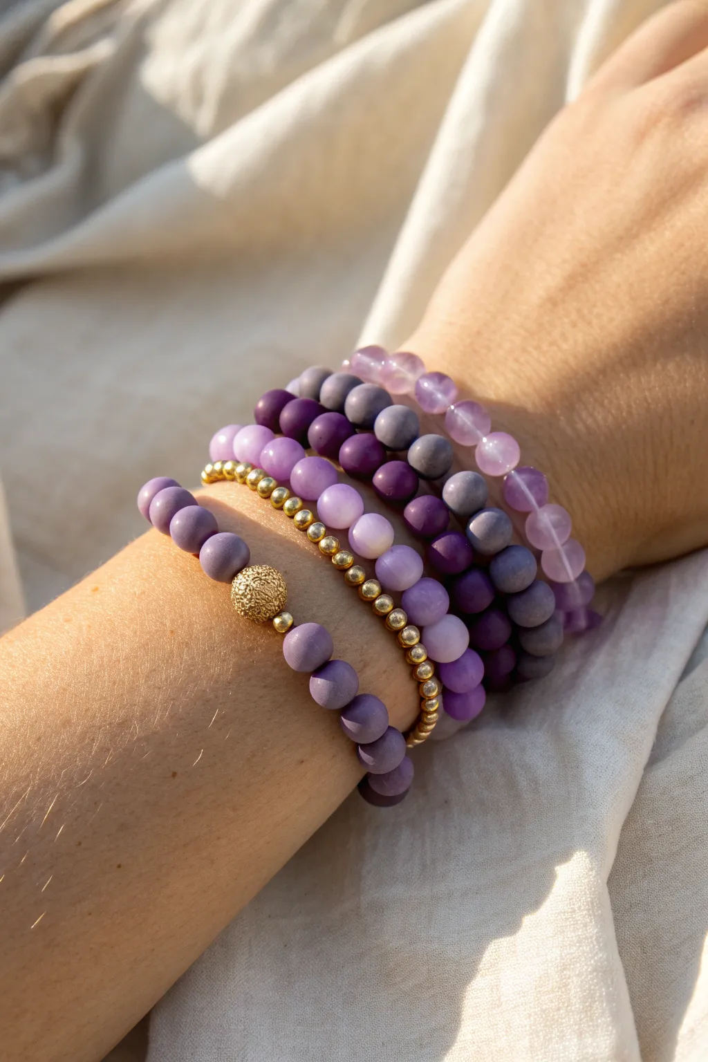 Coordinated purple clay bracelet stack in lavender to violet, minimalist and softly boho.