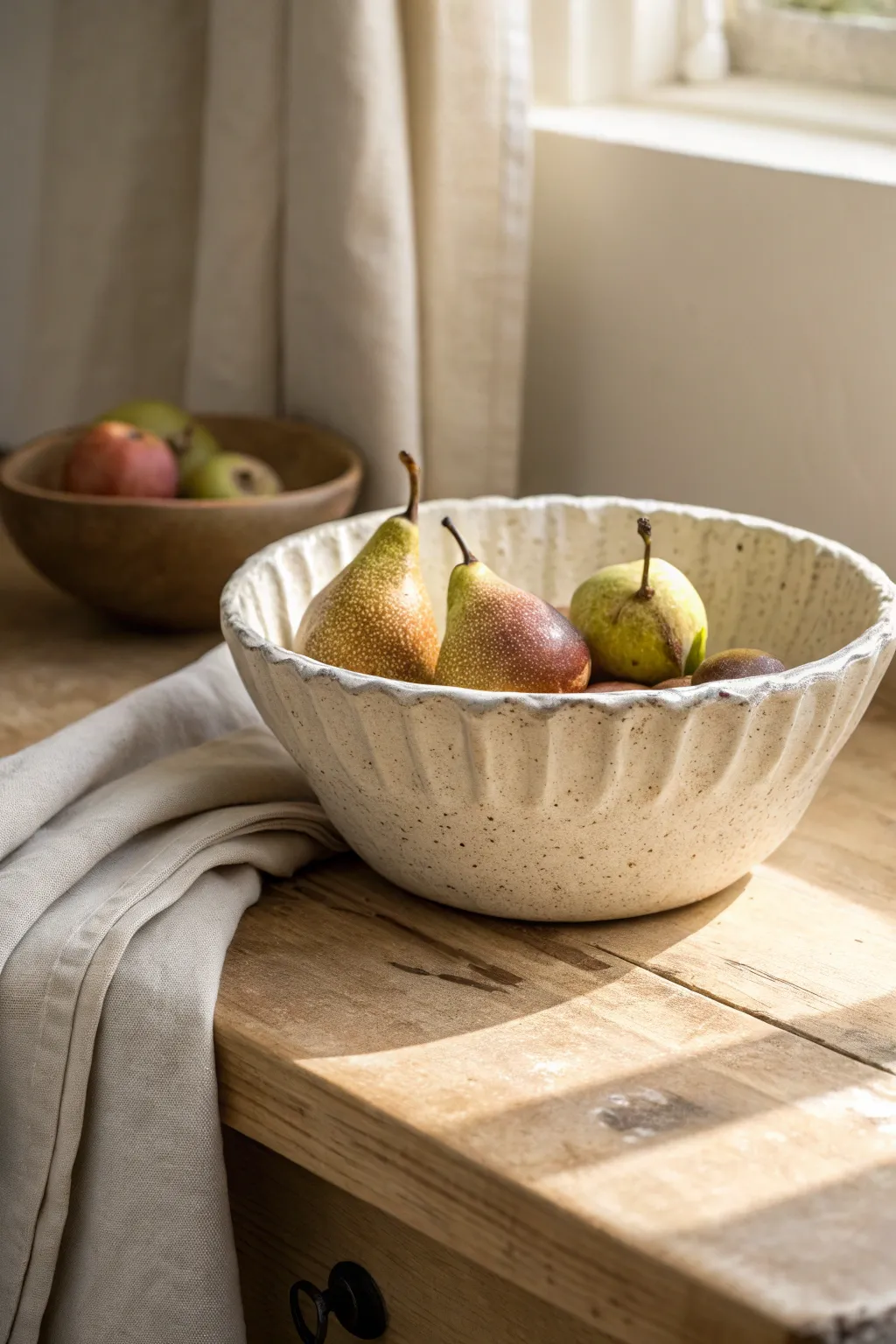 Wavy-rim slab bowl as a simple fruit bowl, with subtle texture and warm minimalist charm.