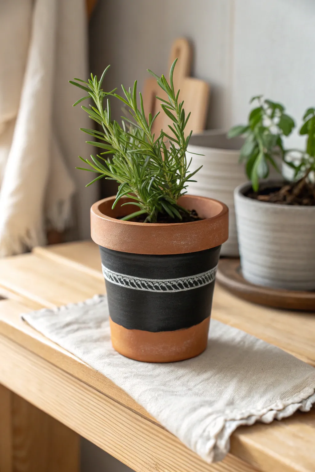 DIY chalkboard-band herb pot in warm terracotta, a clean Scandinavian shelf accent with boho ease.