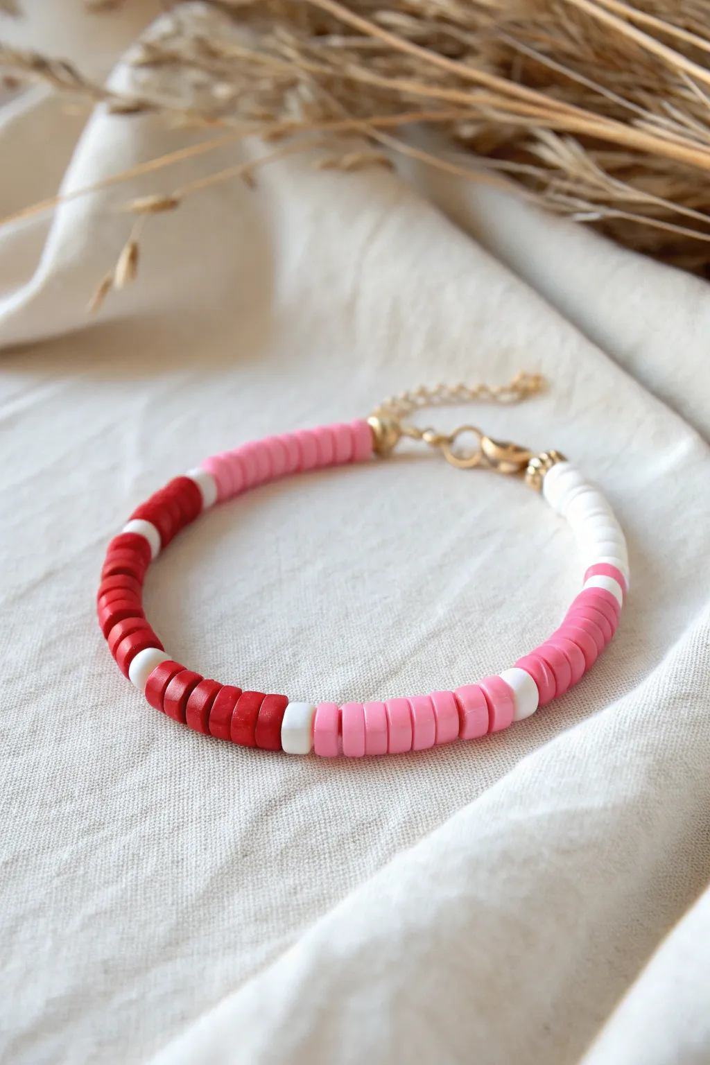 Red, pink, and white color-block clay heishi bracelet for a minimalist Valentine look
