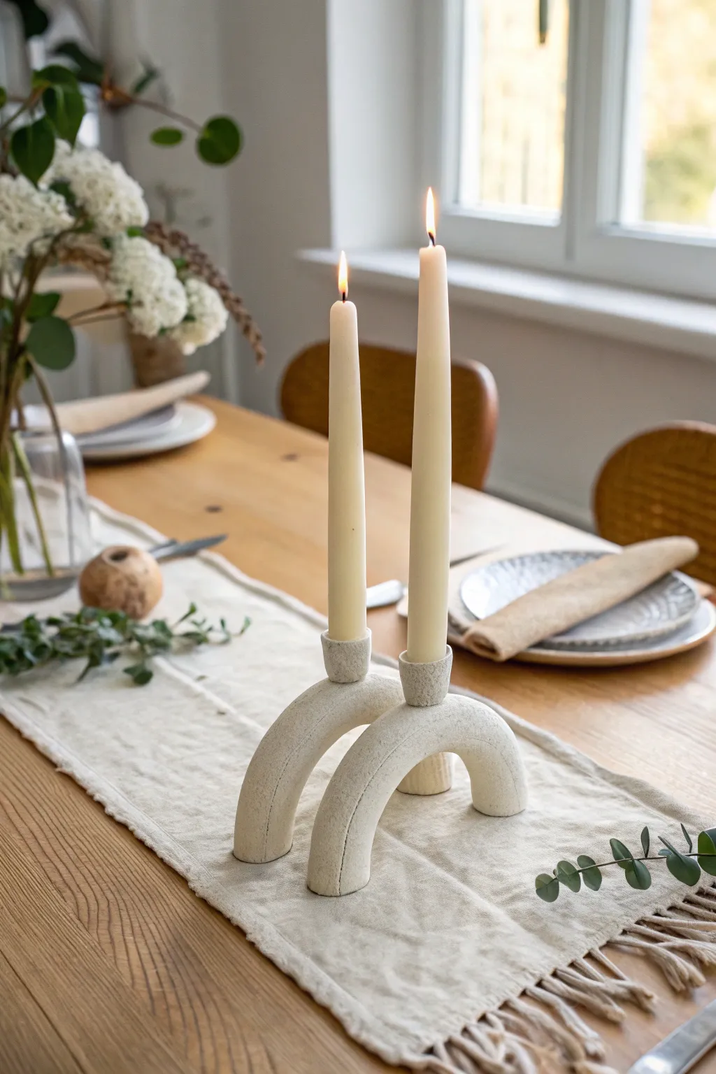 Curvy off-white air-dry clay taper holders with minimalist boho charm and warm natural contrast