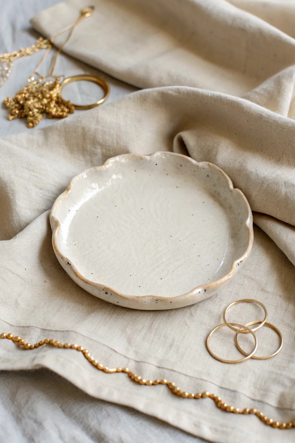 Wavy rim air dry clay plate on linen, minimal and handmade with soft, natural contrast.