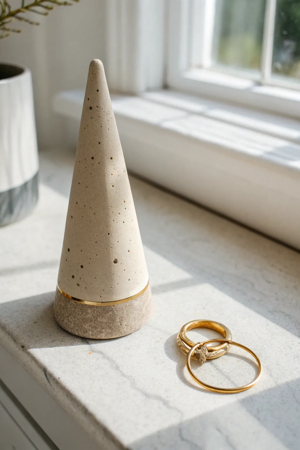 Minimal matte clay ring cone with warm neutral tones, soft shadows, and modern spa-like contrast