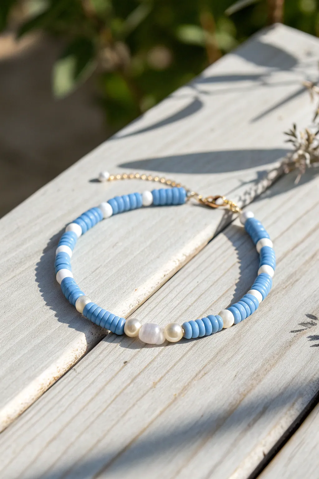 Blue and white heishi bracelet with delicate pearl accents, simple and elegant for everyday wear.