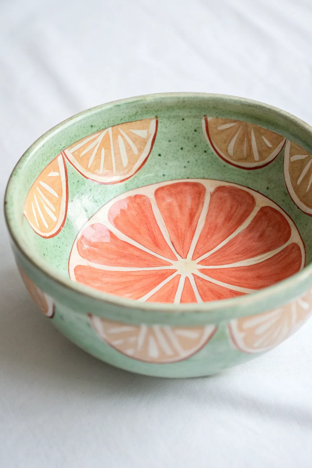Minimal citrus slice bowl interior painting idea with a fresh rind rim and clean modern contrast