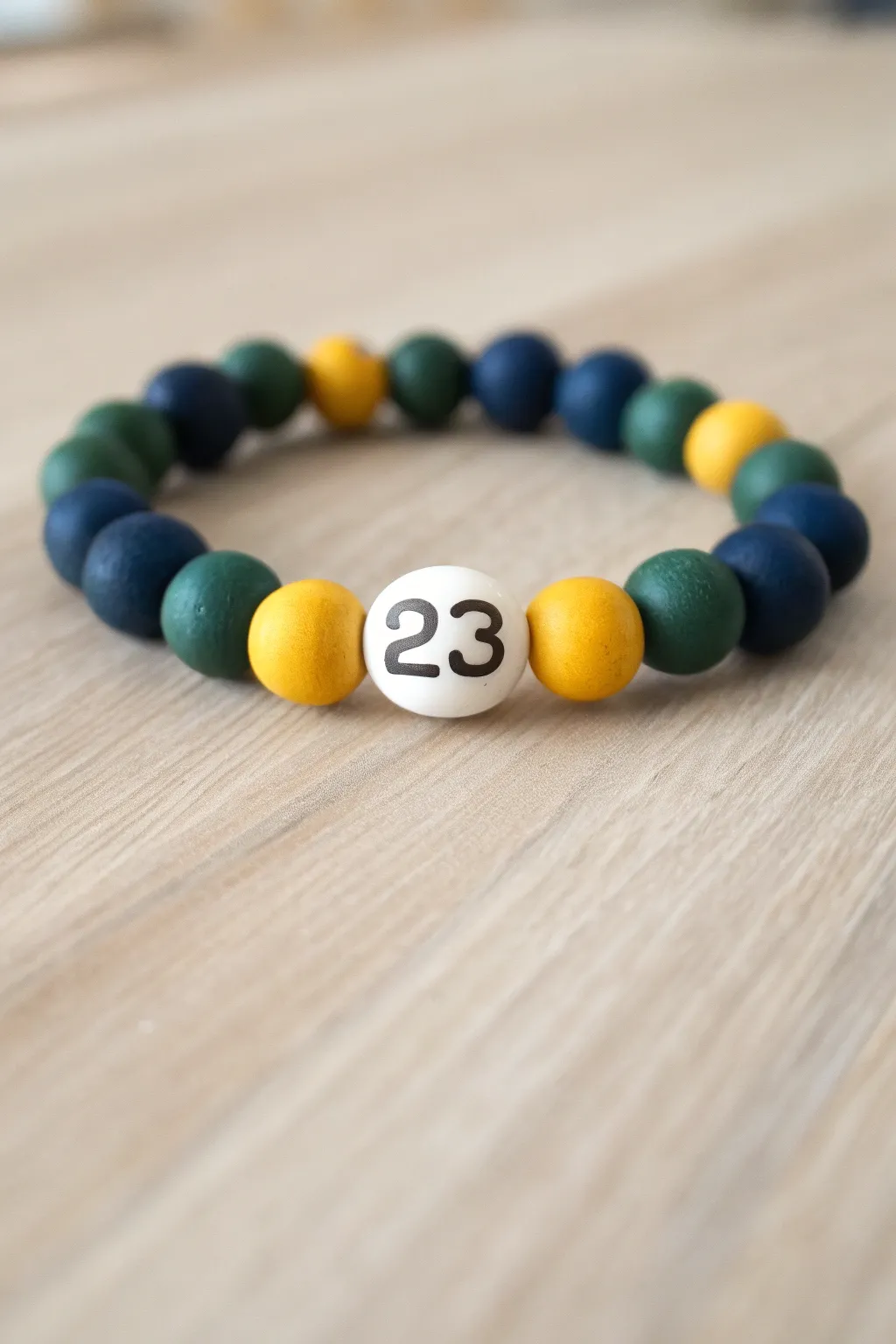 Jersey inspired clay bracelet with bold color blocks and a sporty 23 centerpiece.