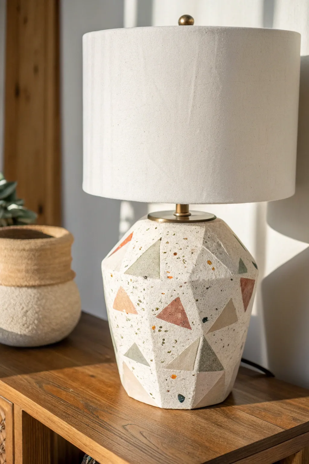 Terrazzo-style clay lamp base with a crisp white shade for a calm, modern boho corner.