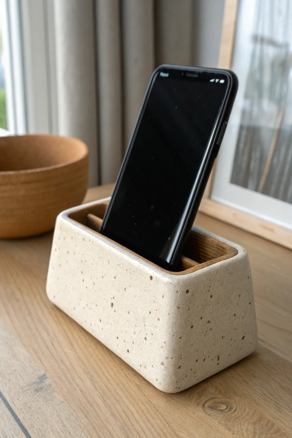 Minimal clay phone stand with two grooves for upright or reclined viewing, simple and chic.