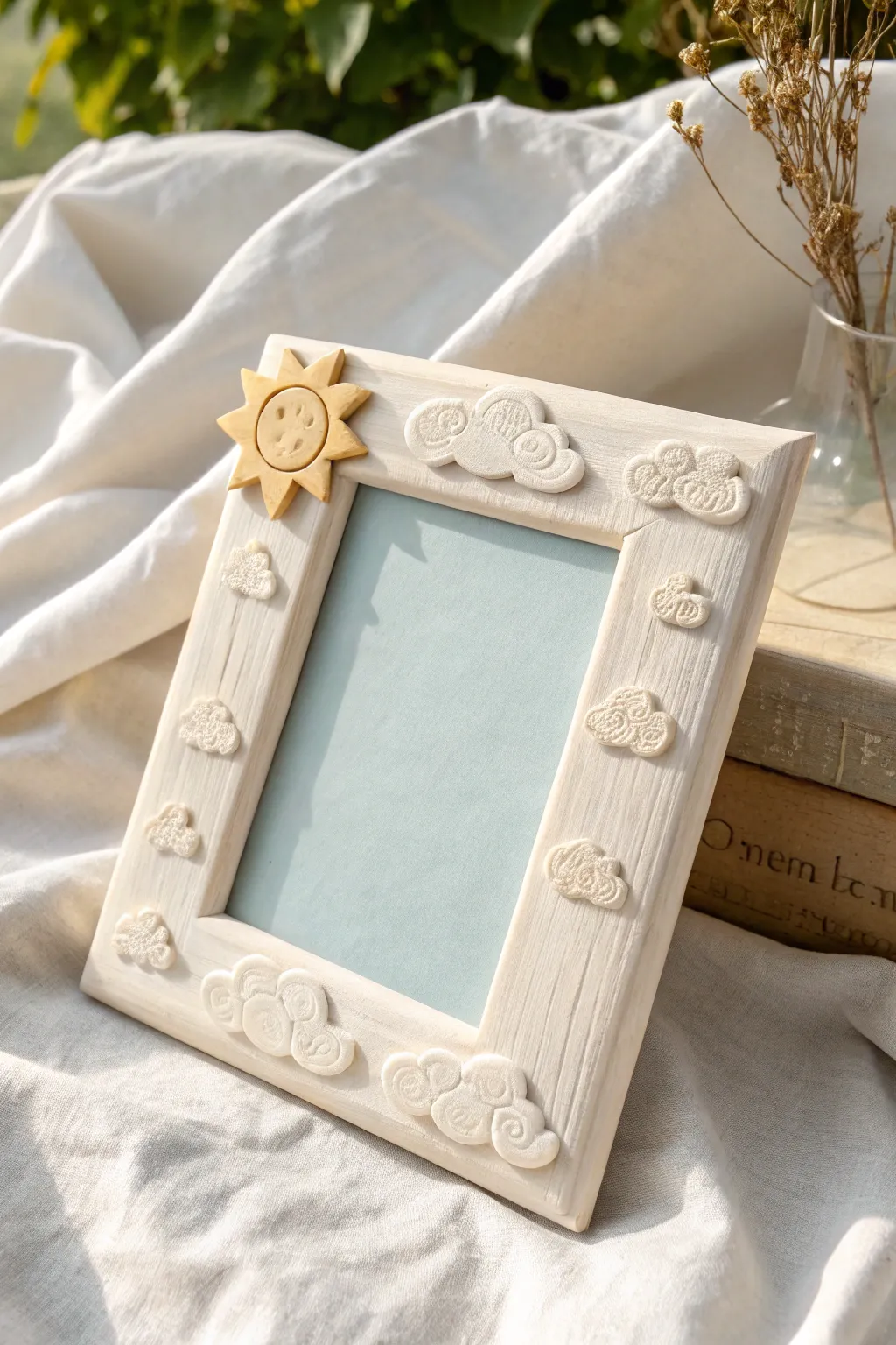 Pastel clay photo frame with soft clouds and a tiny sun, perfect for a dreamy minimalist nook